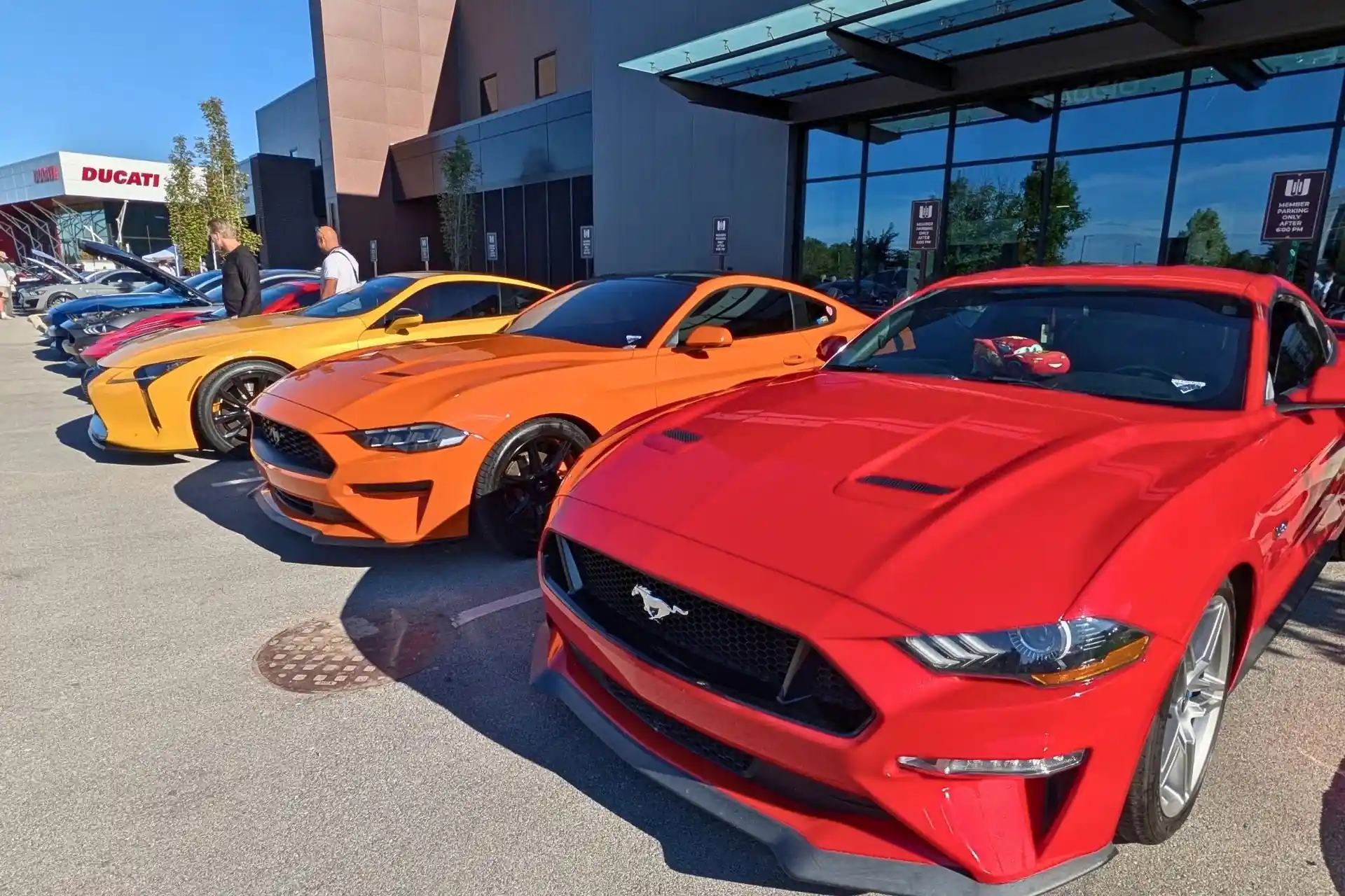 Cars displayed outside Graham Rahal Performance during Cars & Coffee in Zionsville.