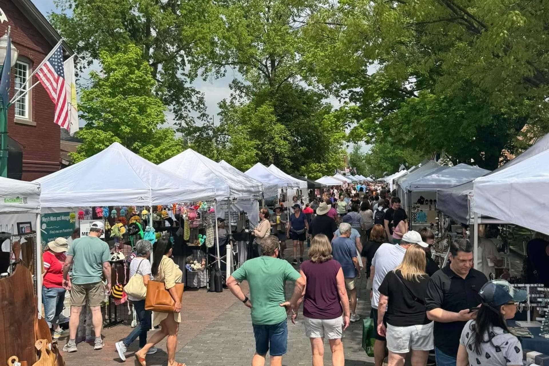 Vendors and shoppers at the Brick Street Market along Main Street in Zionsville