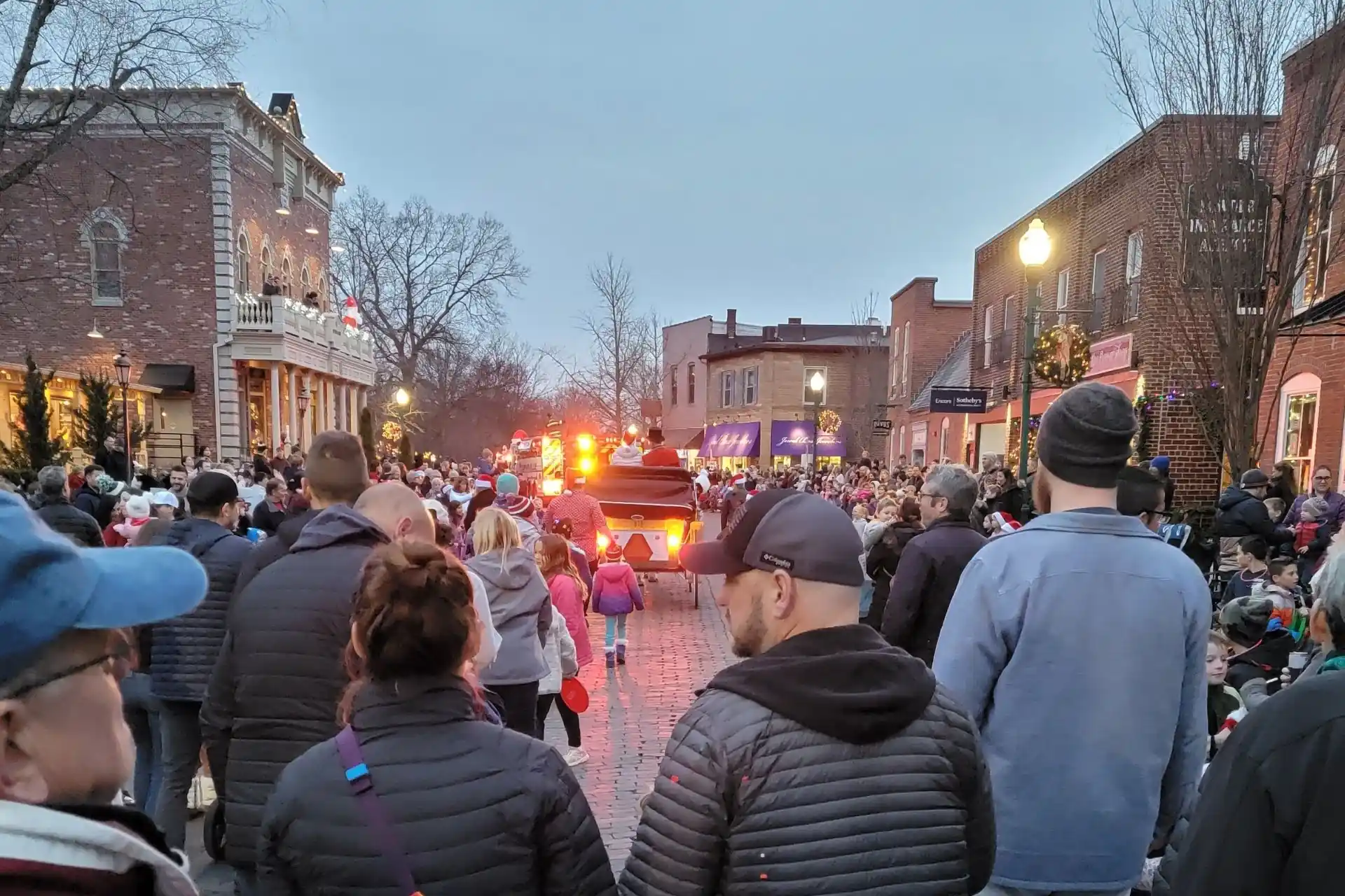 Crowds lining Main Street in Zionsville during the Christmas in the Village parade