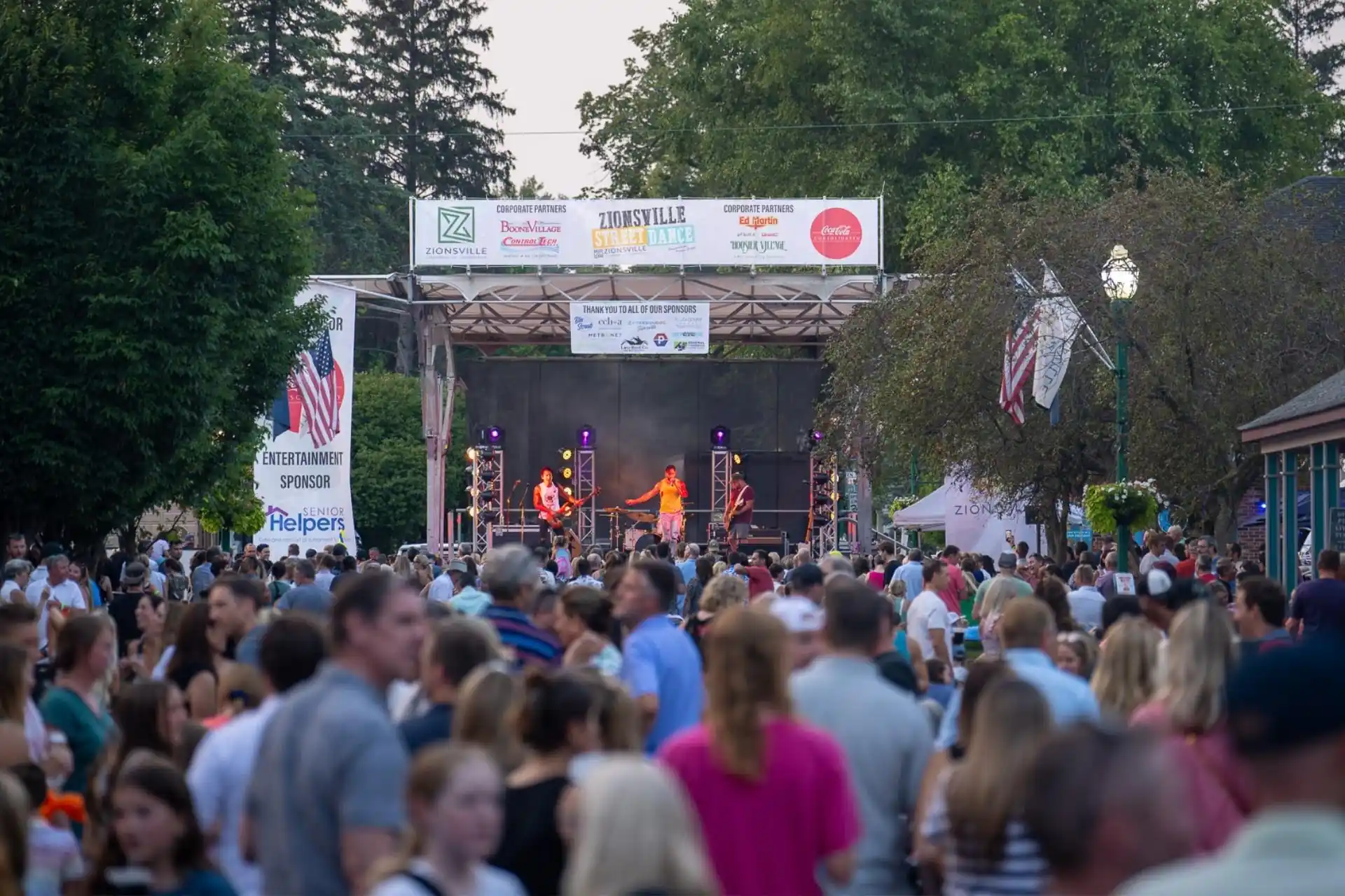 Crowd gathered on Main Street in downtown Zionsville during the Zionsville Street Dance