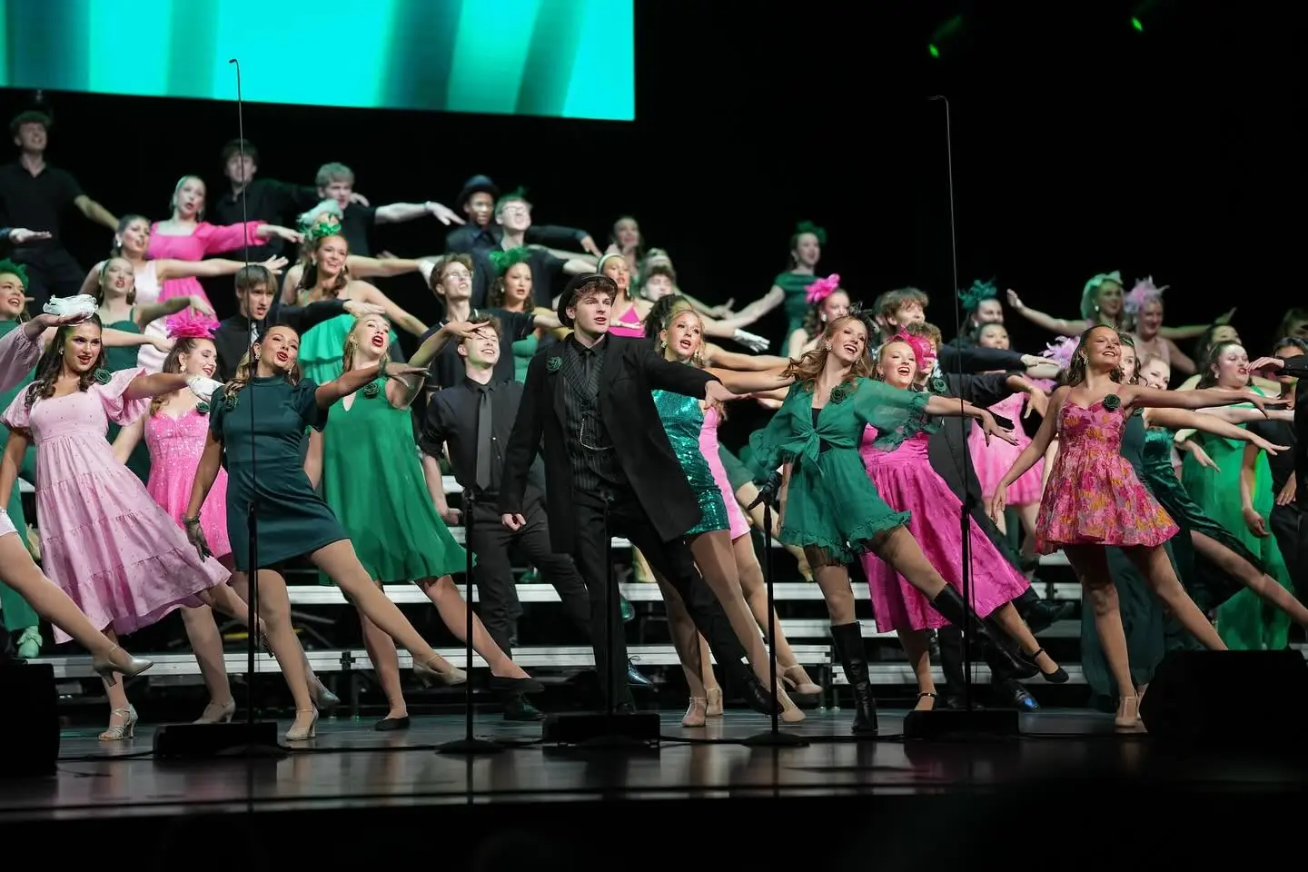 Zionsville Community High School students performing a musical on stage at the STAR Bank Performing Arts Center.