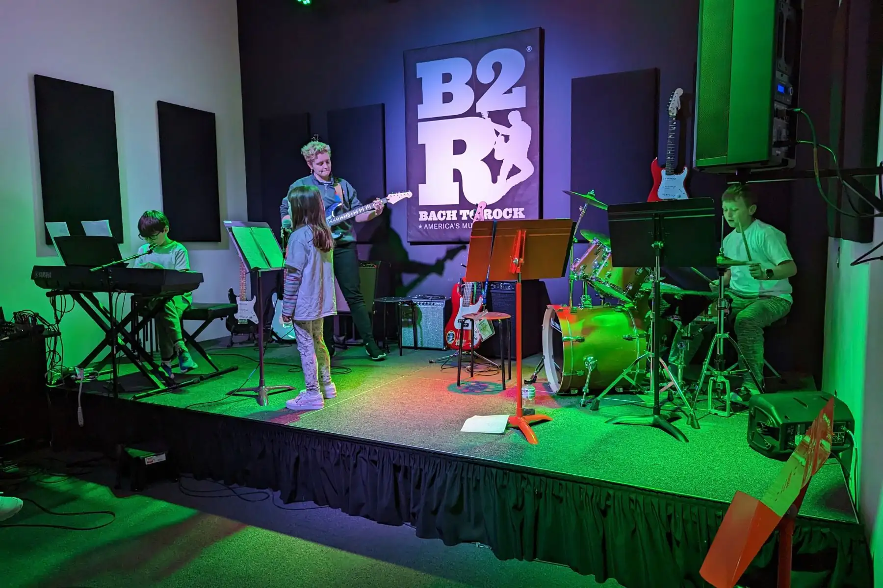 Students perform together on stage at Bach to Rock music school in Zionsville.