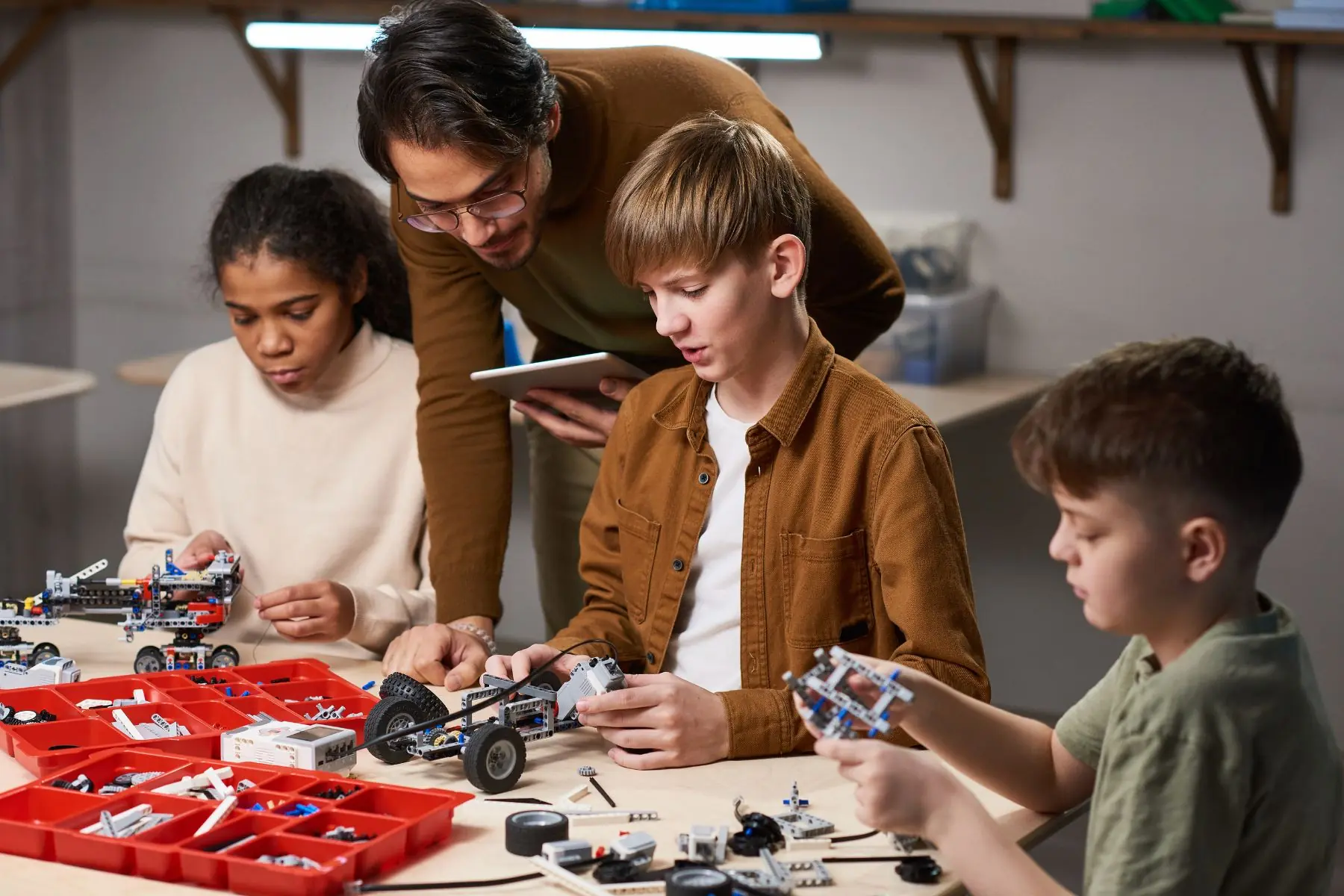Students build and program robots during a hands-on robotics class.