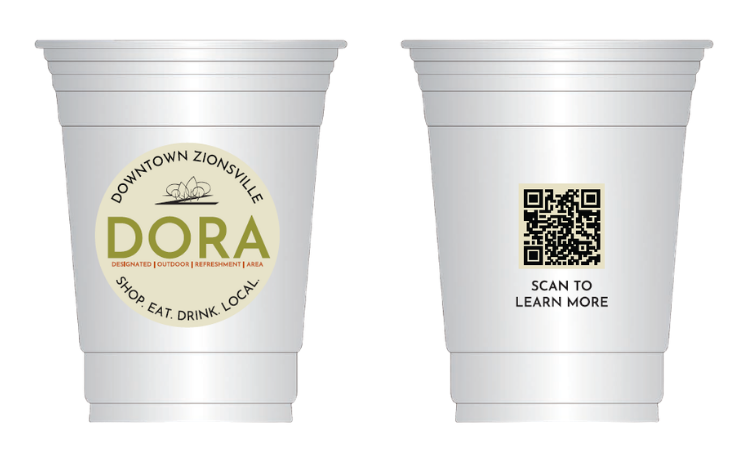 The official Zionsville DORA logo featured on permitted beverage containers, displaying the green and black program branding for the Designated Outdoor Refreshment Area.