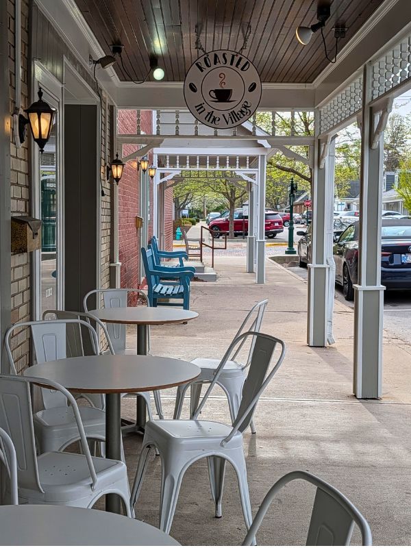 Outdoor seating at Roasted in the Village coffee shop in downtown Zionsville, Indiana