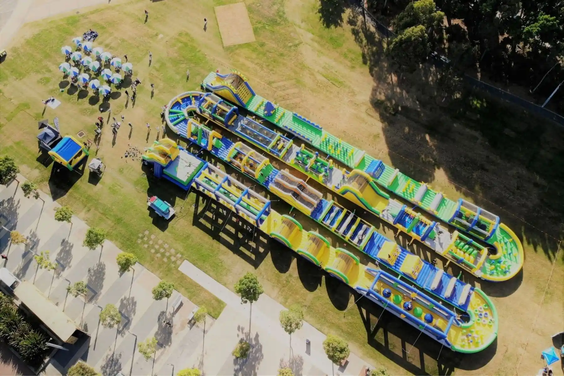 Aerial view of the Tuff Nutterz inflatable course with multiple obstacle sections, slides and climbing features.